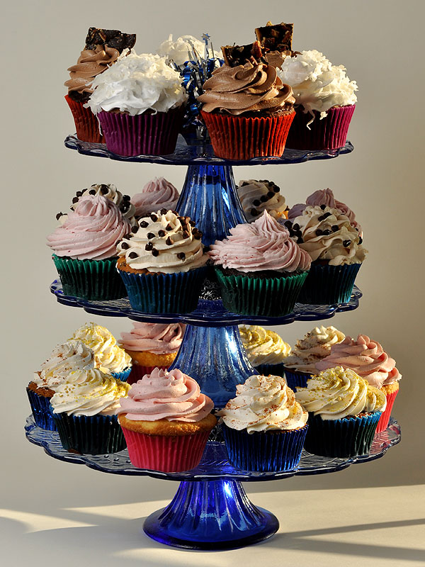 Christmas Eve cupcakes<br>Top: Purple sweet potato & chocolate with buttercrunch candy<br>Middle: Chocolate chip & vegan chocolate<br>Bottom: Raspberry, fruitcake, & ginger spice